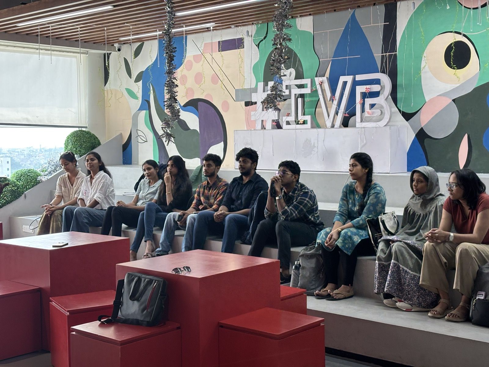 Students seated on the steps during a session